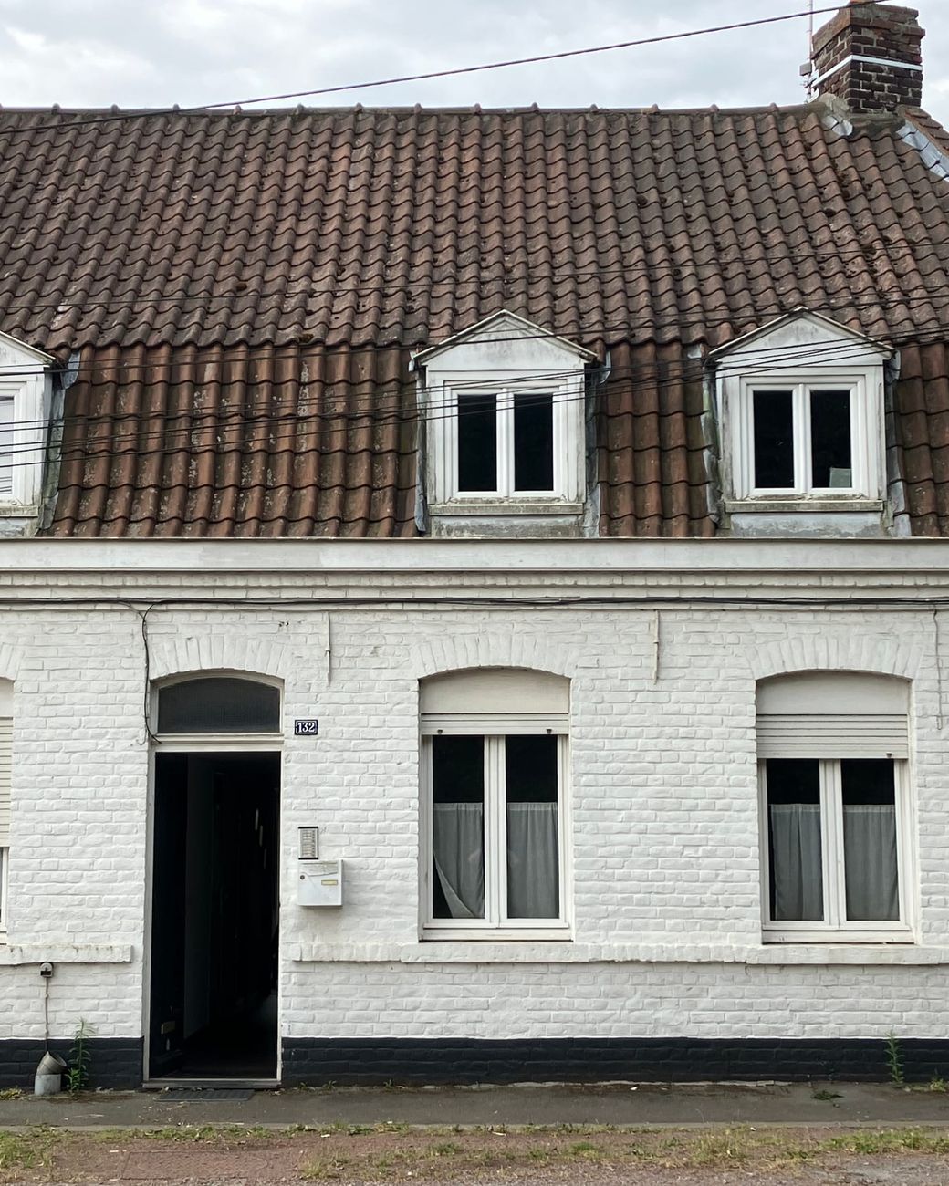 Front of the Immotav house, a white brick house in Villeneuve-d'Ascq