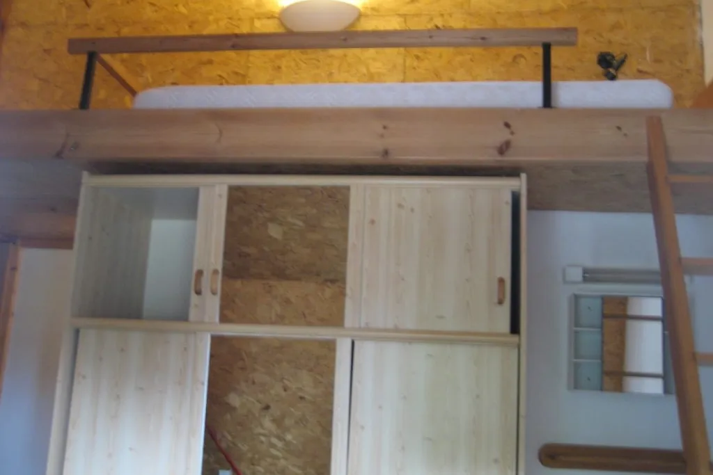 Room 7 with mezzanine bed and pine wardrobe