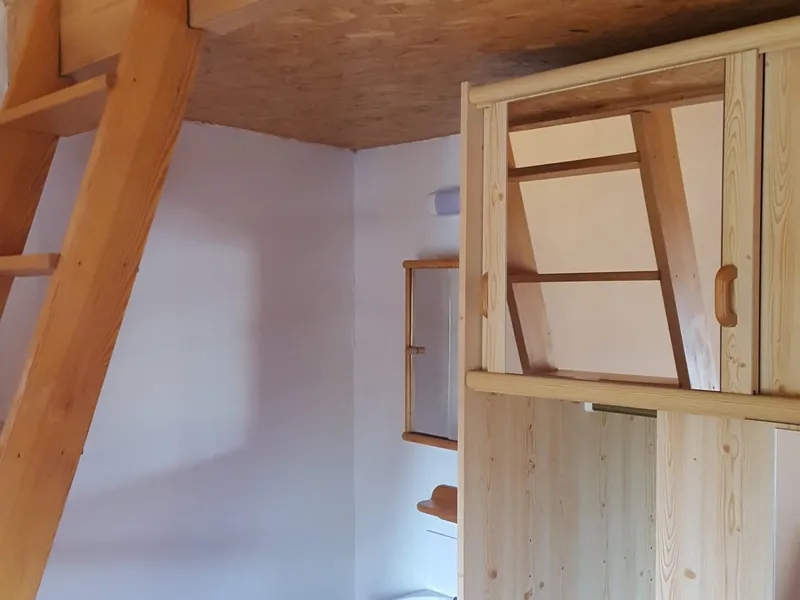 Room 4 with mezzanine bed, pine wardrobe and private washbasin