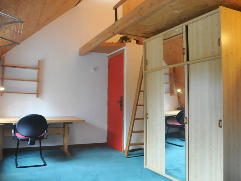 Attic room 5 with desk, wooden wardrobes and mezzanine bed