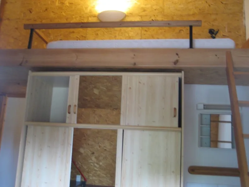 Room 7 with mezzanine bed and pine wardrobe