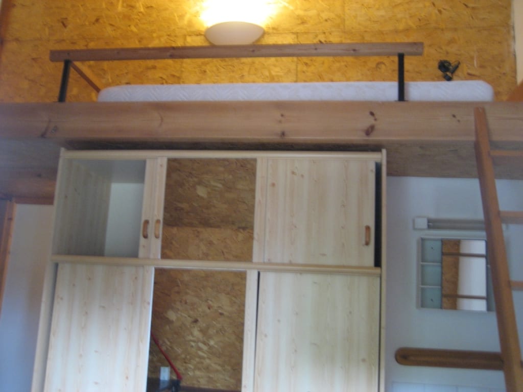 Room 7 with mezzanine bed and pine wardrobe